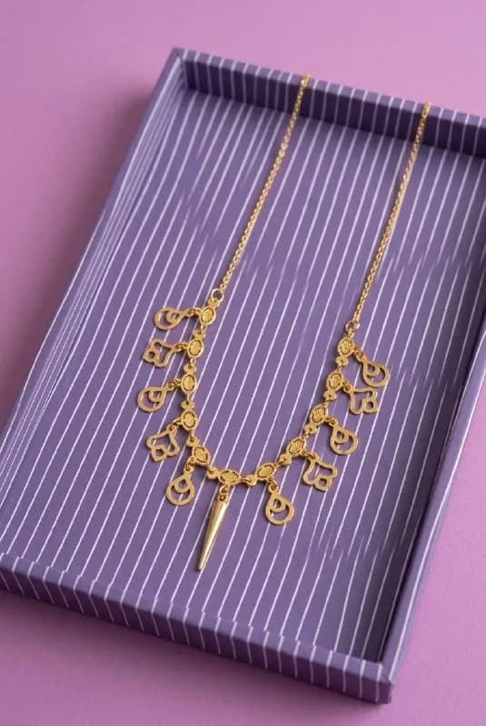 Gold Paisley Charm Spike Necklace
